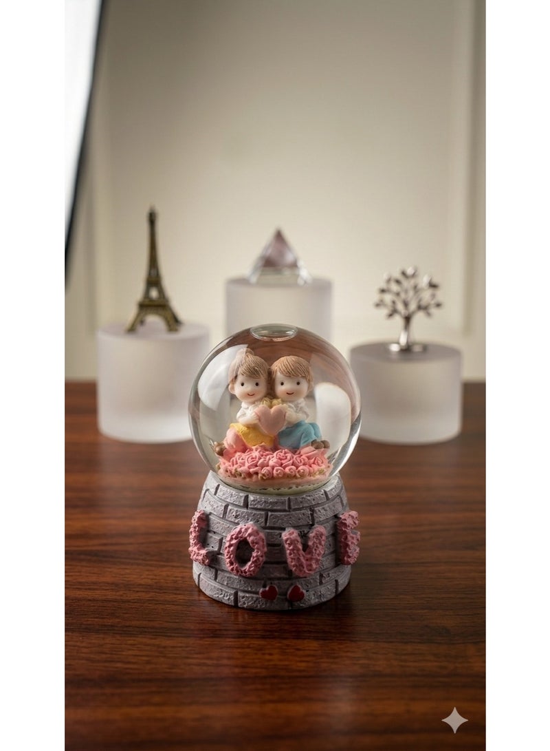 A luminous snow globe glass crystal with a "love" design, cartoon characters, and a decorative base - a perfect gift for any occasion.