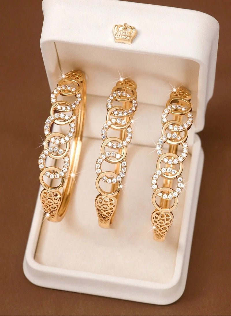 Women's Bracelets – Set of 3 A set of 3 gold-plated women's bracelets adorned with sparkling zirconia stones in a circular design. Perfect for weddings, engagements, graduation gifts, Mother’s Day, Valentine’s Day, and all special occasions.  - Image 1
