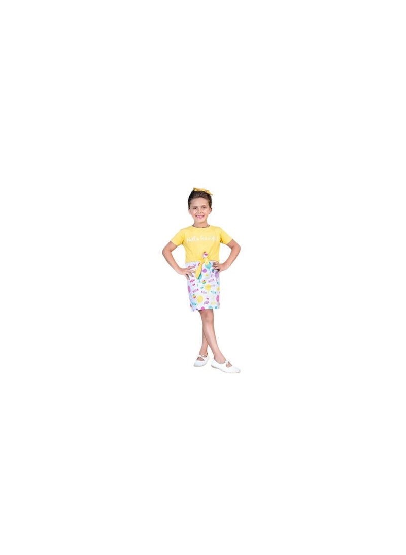 A white girl's dress with drawings and a yellow top 