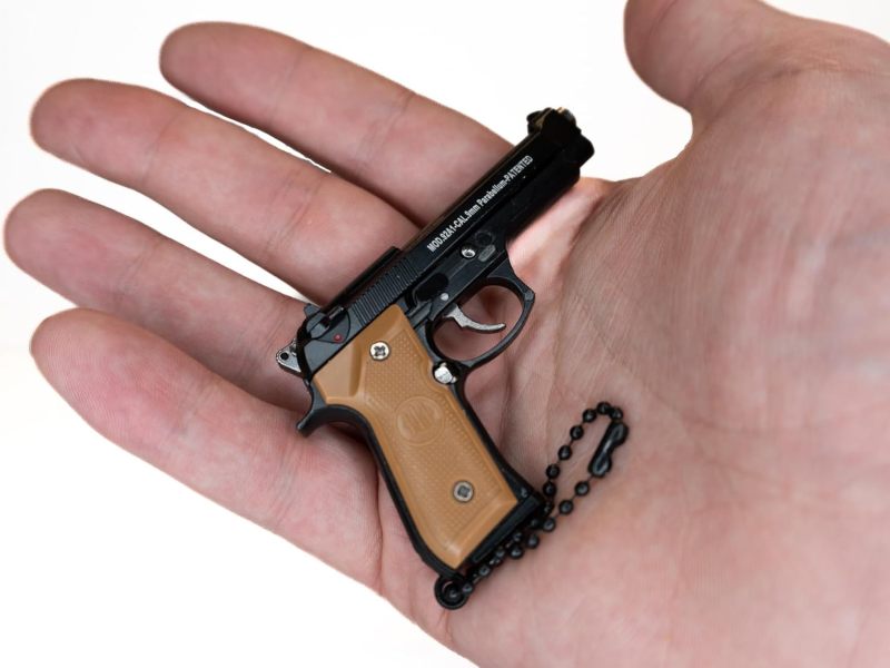 Miniature M9 Pistol Keychain Accessory - Tactical Realistic Appearance Durable Metal Construction for Firearm Enthusiasts Collectors - Image 1