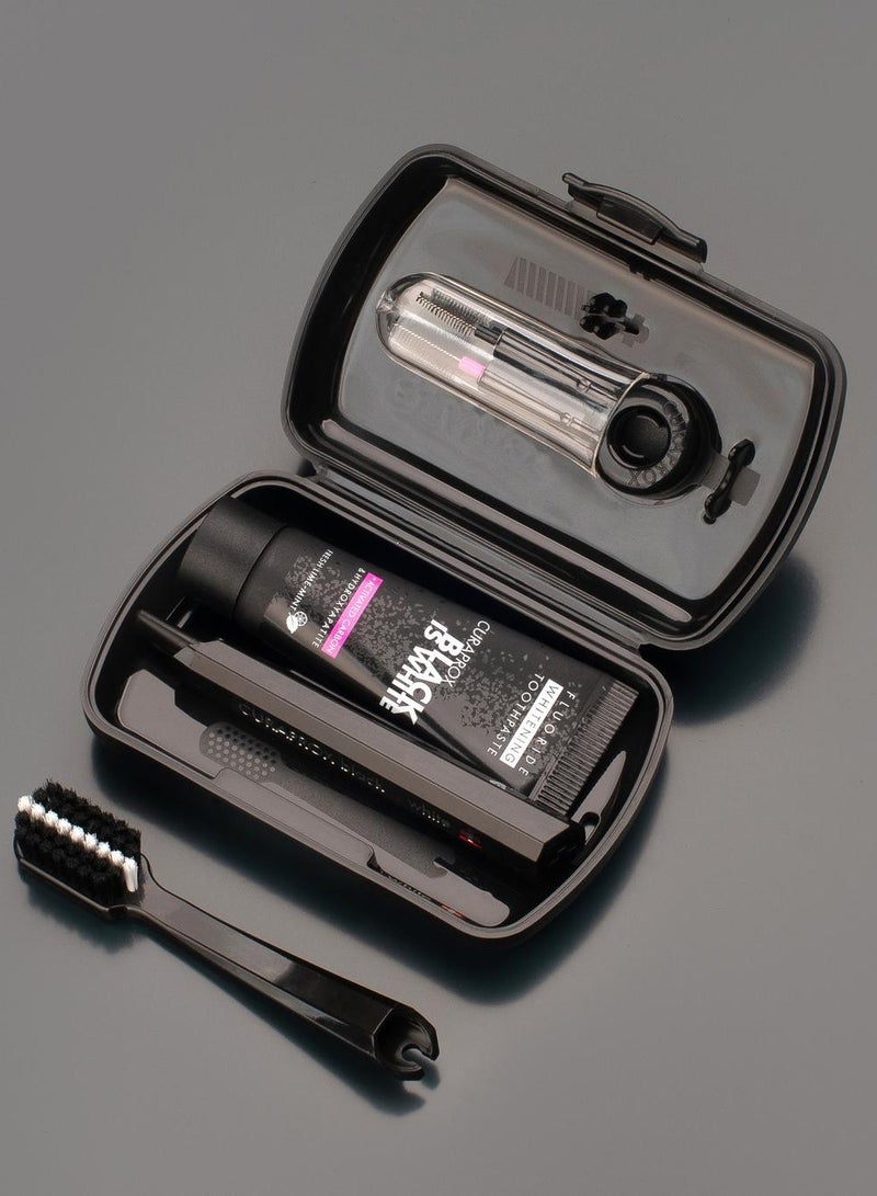 CURAPROX Black is White Travel Set. Set includes Travel Toothbrush CS 5460, 10ml Black is White Toothpaste, Carbon Interdental Brush CPS prime 07, CPS prime 09. - Image 1