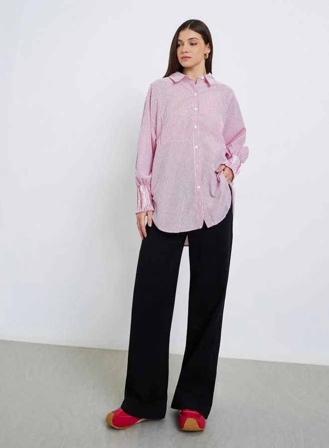 ستايلي بلوزة مخططة بقصة واسعة