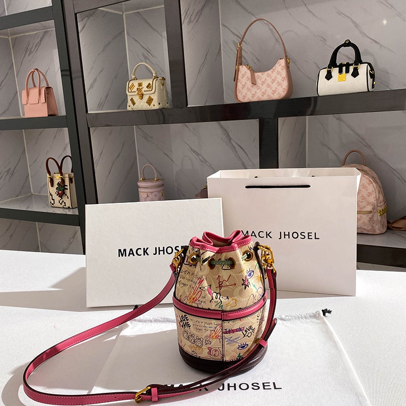 A Generation Of Drawstring Graffiti Bucket Bag 2024 High Sense Of Niche Cylinder Handbag - Image 3