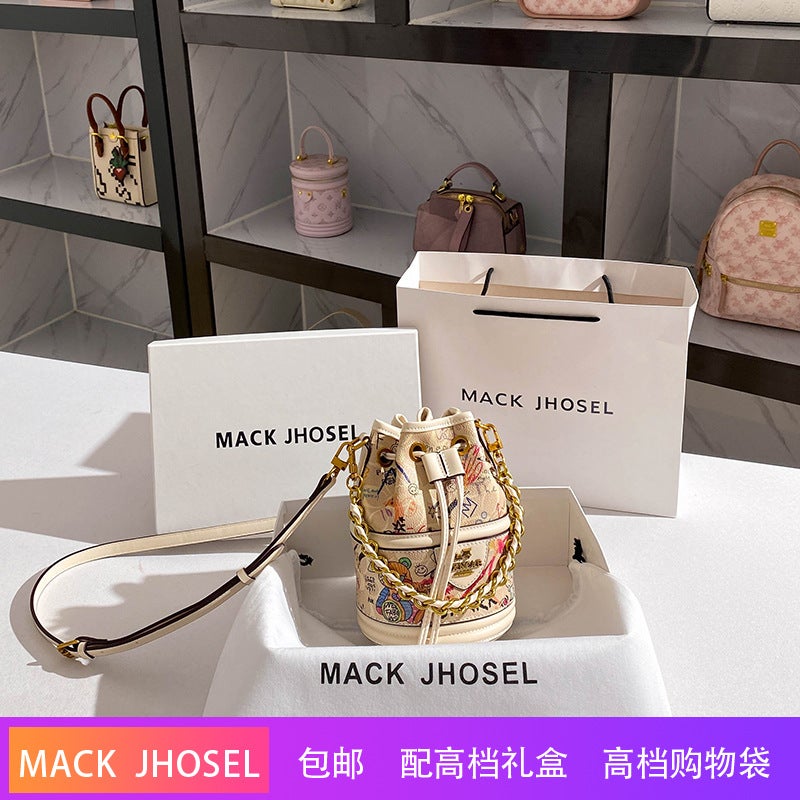 A Generation Of Drawstring Graffiti Bucket Bag 2024 High Sense Of Niche Cylinder Handbag - Image 1
