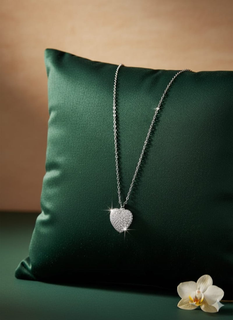 A fully covered, prominent heart-shaped necklace with sparkly, glittery detailing - on a delicate silver-plated chain - with additional links for adjusting the size. - Image 2