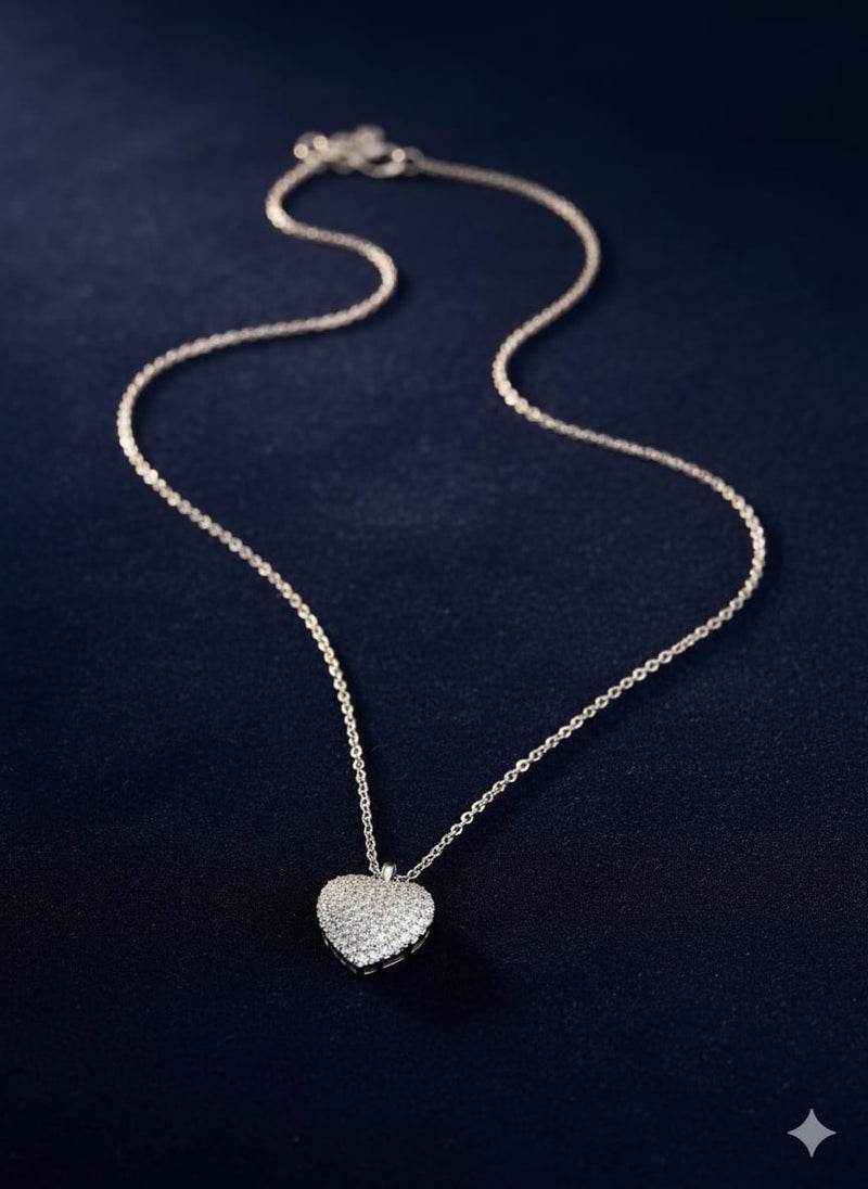 A fully covered, prominent heart-shaped necklace with sparkly, glittery detailing - on a delicate silver-plated chain - with additional links for adjusting the size. - Image 3