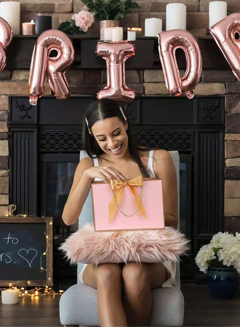 2 kraft paper gift bags with gold twisted rope handles and a pink silk satin ribbon to close the bag. Perfect for giving thoughtful gifts for weddings and bachelorette parties. - Image 2