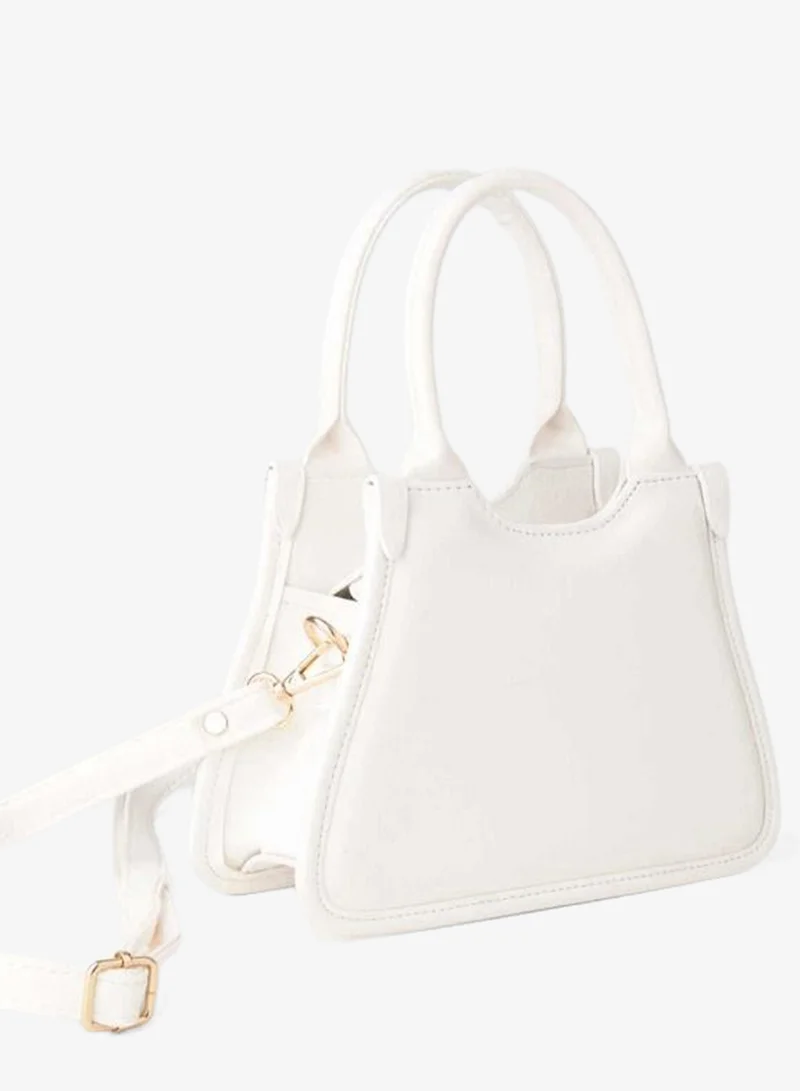 Women's Sakura White Small Adjustable Strap Hand and Shoulder Bag with Zipper Closure.