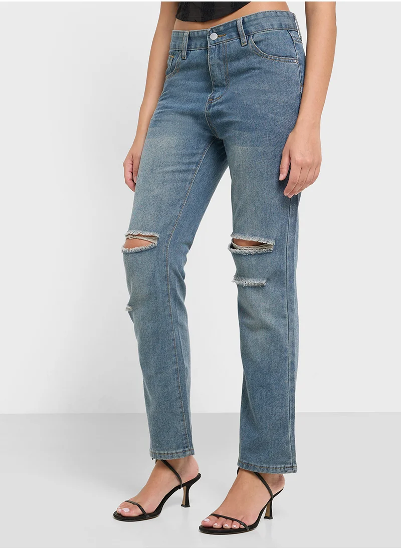 جينجر High Rise Relaxed Fit Ripped Jeans