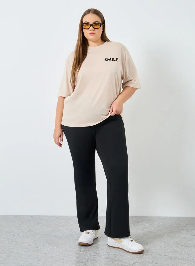 Styli Styli Women Plus Size Flared Black Leggings
