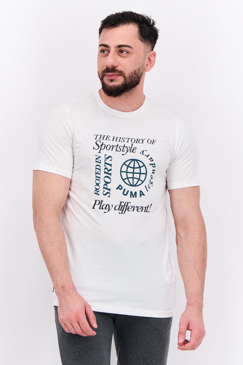 PUMA Men Sportswear Fit Graphic Print Short Sleeves Training T-Shirt, Warm White - Image 1