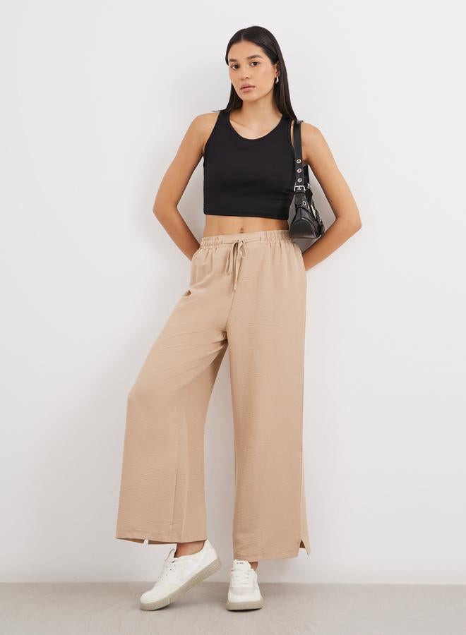 Styli Solid Drawstring Waist Wide Leg Pants - Image 1