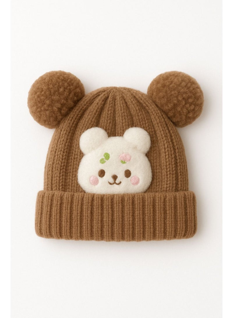 قبعة بيني سادة للجنسين t a l 7 a (بني ) قبعة صغيرة بتصميم شخصية كرتونية وكرات صوفية. - Image 1