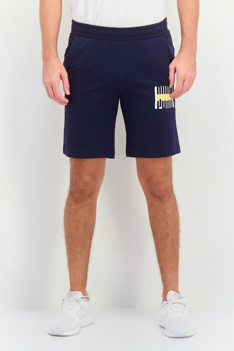 PUMA شورتات خارجية ضيقة للرجال بشعار العلامة التجارية، أزرق داكن - Image 1