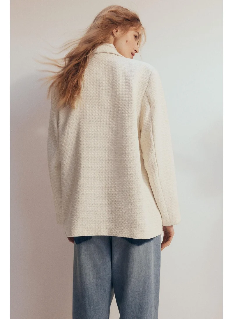 اتش اند ام بليزر محبوك من نسيج منقوش