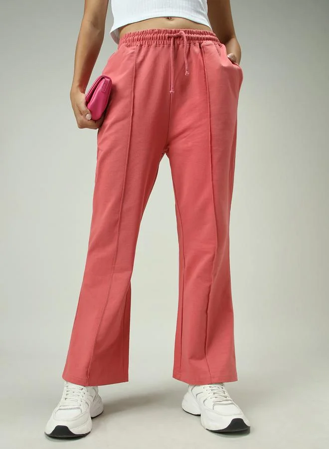 Outzidr  Pink Solid Pintuck Flared Joggers for Women | Best Price UAE