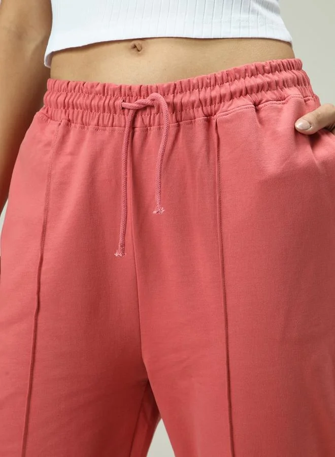 Outzidr  Pink Solid Pintuck Flared Joggers for Women | Best Price UAE