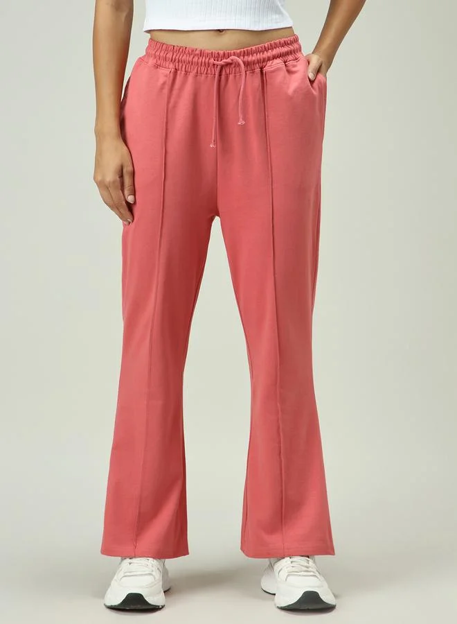 Outzidr  Pink Solid Pintuck Flared Joggers for Women | Best Price UAE