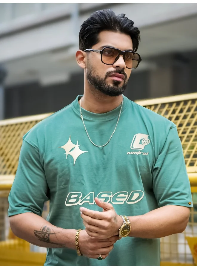 مانياك تيشيرت قطن رجالي بطباعة دائرية برقبة نصف كم بلون أخضر بيرلي وكريمي