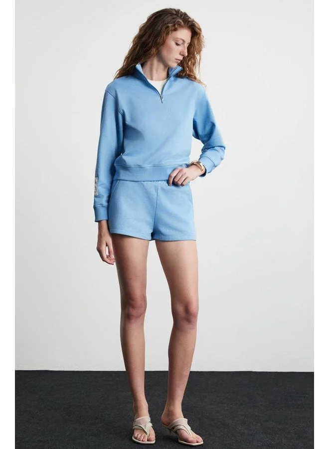 Ethiquet DANIXA Women's 3-Thread Inside Sherpa Lined Decorative Tag Detailed Mini Blue Shorts.
