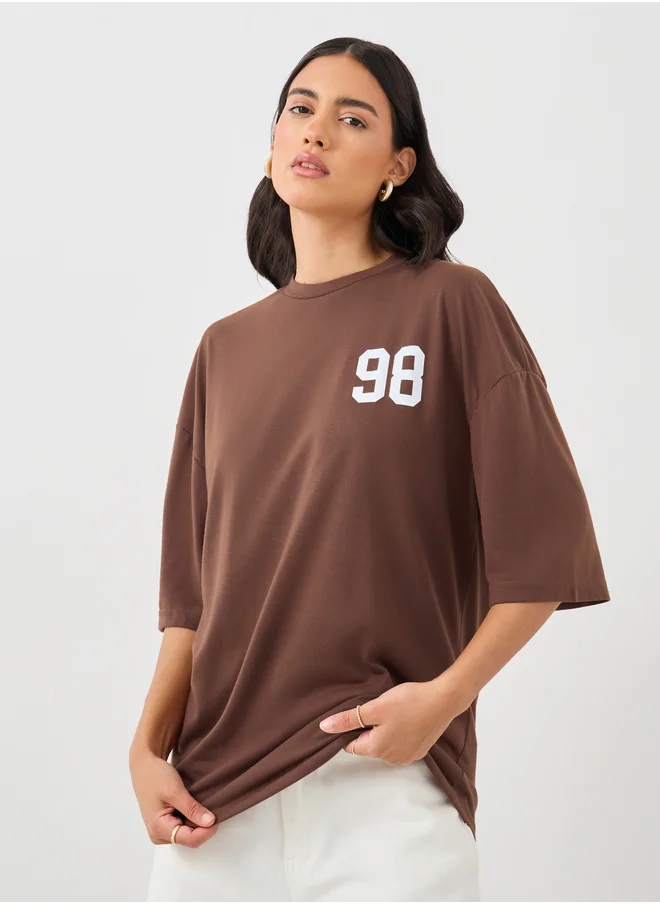 ستايلي Styli Slogan Print Round Neck Oversized T-Shirt