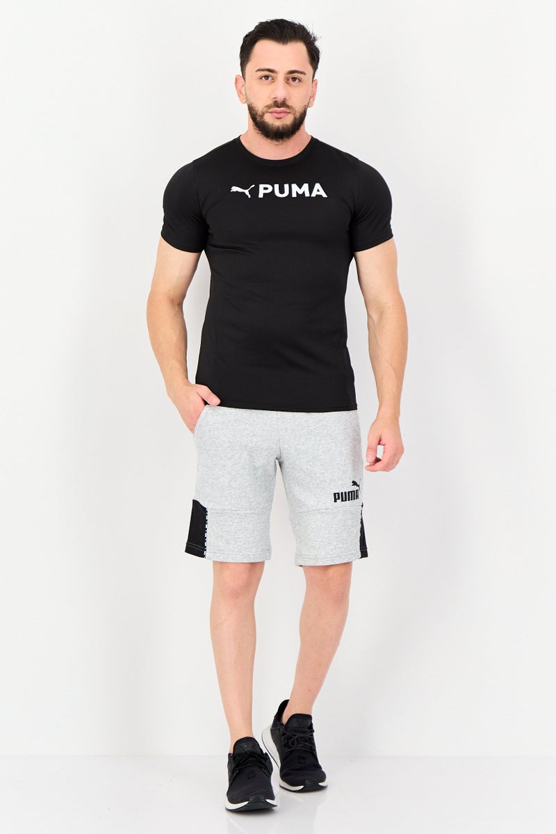 PUMA Men Sportswear Fit Brand Logo Short Sleeves Training T-Shirt, Black - Image 4