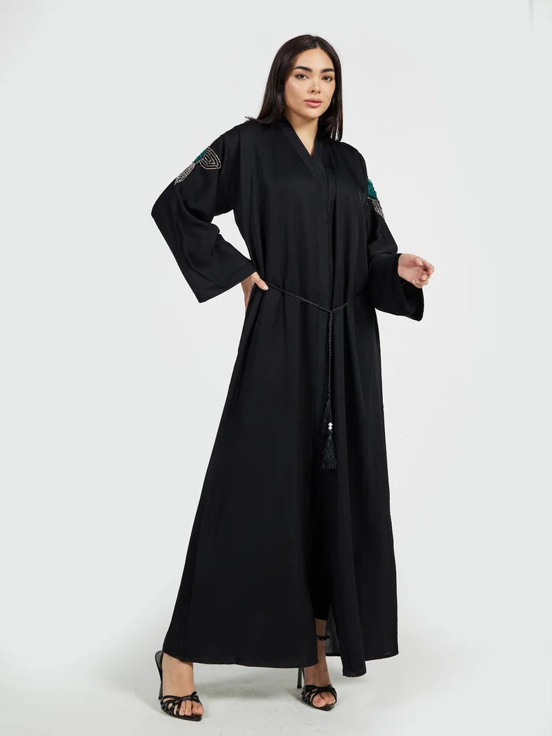 Reem Abayas Designer Black Abaya with Emerald Green Crystal Shoulder Appliqué