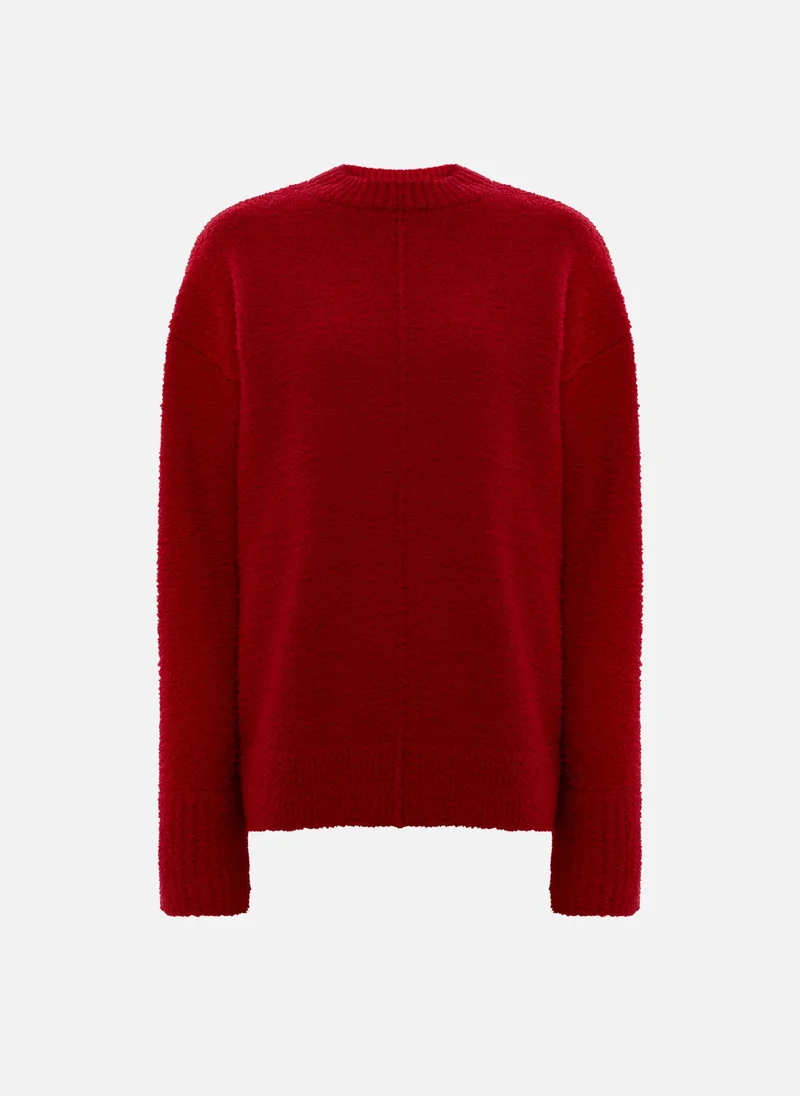 ليتشي سترة محبوكة ذات ملمس مميز مع تفاصيل مضلعة