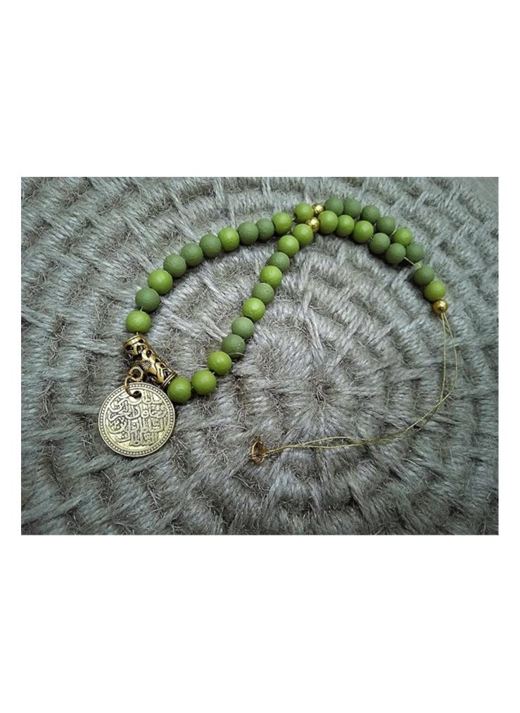 tag Rosary yellowish green color 33 beads with a golden religious pendant  - Image 1