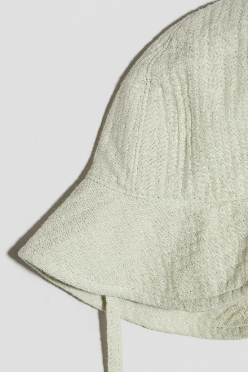 اتش اند ام قبعة واقية من الشمس من قطن الموسلين