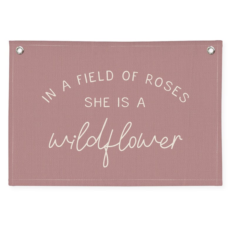Wheatwin Wildflower Nursery Decor, Girls Room Decor, In a Field Full of Roses She Is a Wildflower Banner, Pink Linen Banner Flag Decor for Little Girl Baby Girl, Girls Room Wall Decor Canvas Banner - Image 1