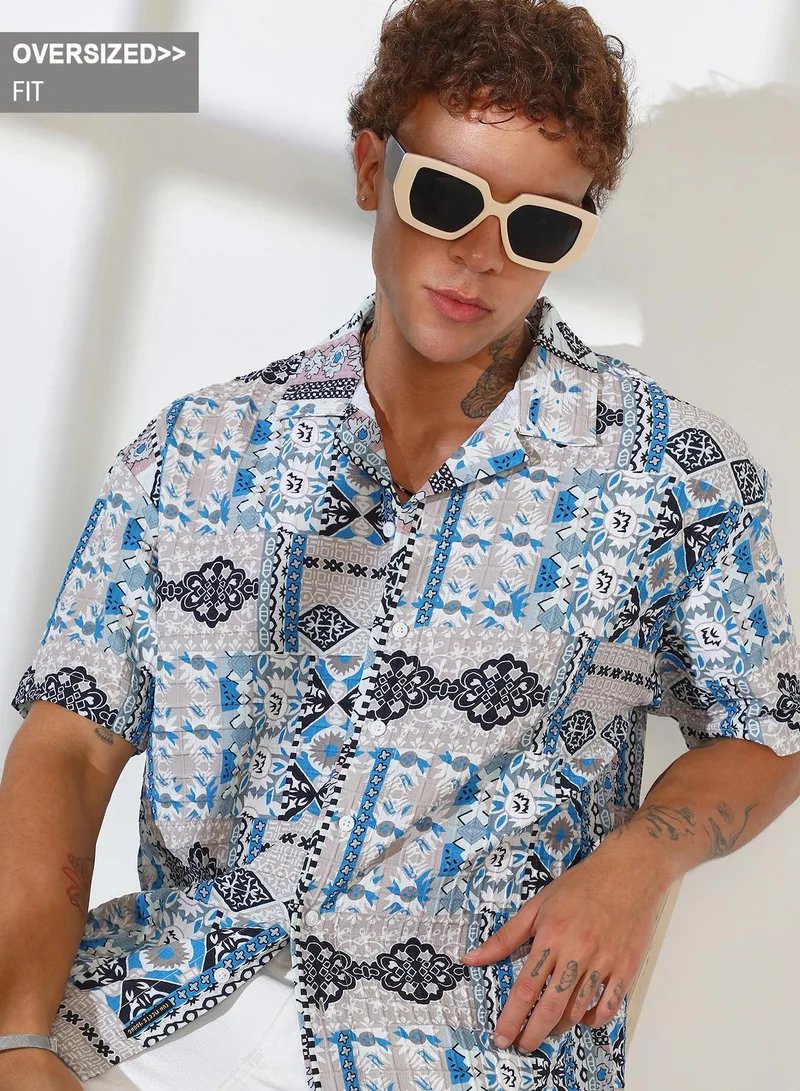 Campus Sutra Campus Sutra Men's Sky Blue & Cloud Grey Bohemian Impressions Oversized Shirt For Casual Wear | Cuban Collar | Short Sleeve | Button Closure | Oversized Shirt Crafted With Comfort Fit For Everyday Wear