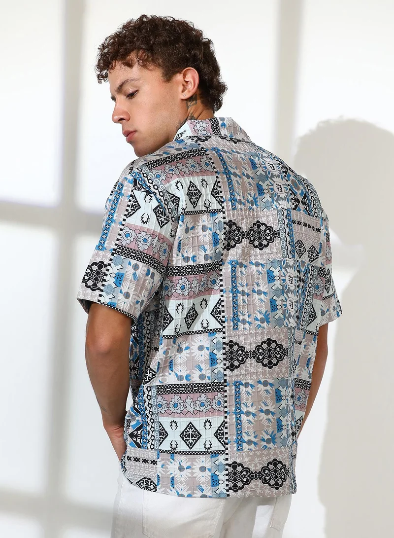 Campus Sutra Campus Sutra Men's Sky Blue & Cloud Grey Bohemian Impressions Oversized Shirt For Casual Wear | Cuban Collar | Short Sleeve | Button Closure | Oversized Shirt Crafted With Comfort Fit For Everyday Wear