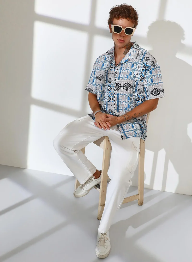 Campus Sutra Campus Sutra Men's Sky Blue & Cloud Grey Bohemian Impressions Oversized Shirt For Casual Wear | Cuban Collar | Short Sleeve | Button Closure | Oversized Shirt Crafted With Comfort Fit For Everyday Wear