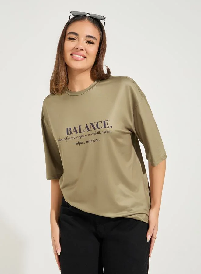 Styli Oversized Balance Slogan T-Shirt with Dropped Shoulder