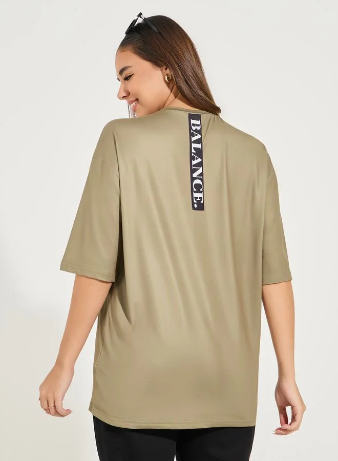 Styli Oversized Balance Slogan T-Shirt with Dropped Shoulder