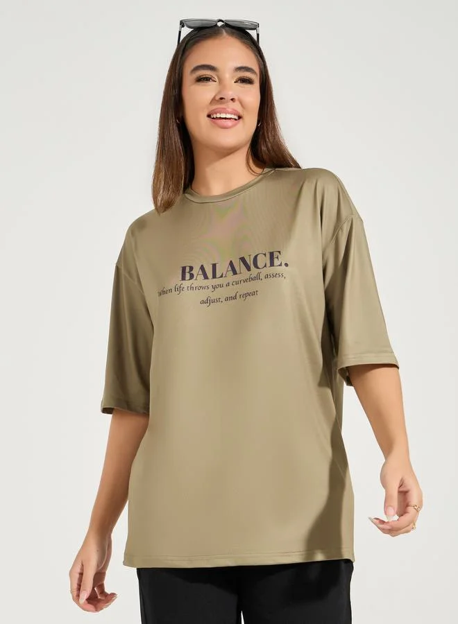 Styli Oversized Balance Slogan T-Shirt with Dropped Shoulder