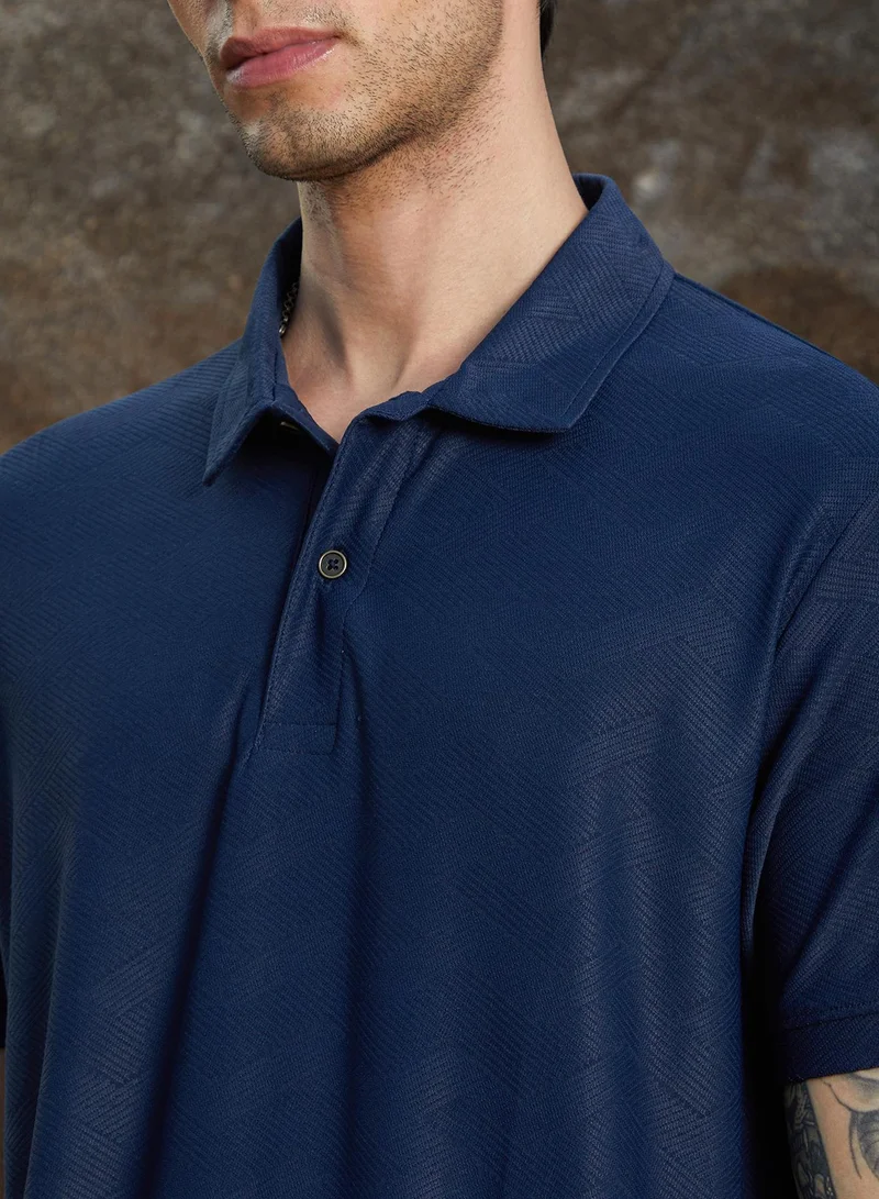 Campus Sutra Campus Sutra Men's Indigo Blue Basket-Textured Polo T-Shirt For Casual Wear | Polo Neck | Short Sleeve | Half-Button Closure | Oversized Shirt Crafted With Comfort Fit For Everyday Wear