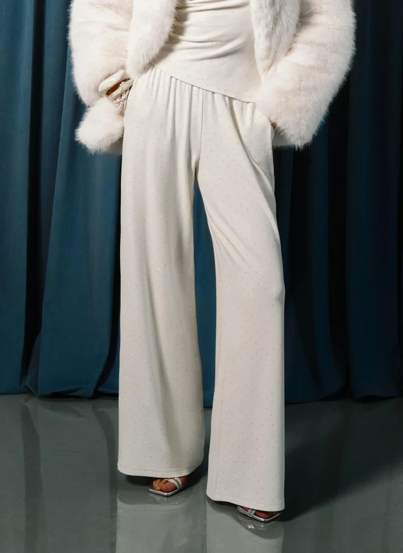 ليتشي بنطال جيرسي مرصع بأحجار الراين