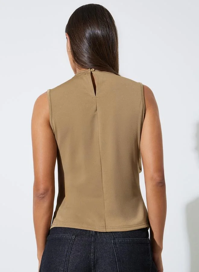 Styli  Beige Sleeveless Asymmetric Hem Waistcoat Top for Women | Best Price UAE