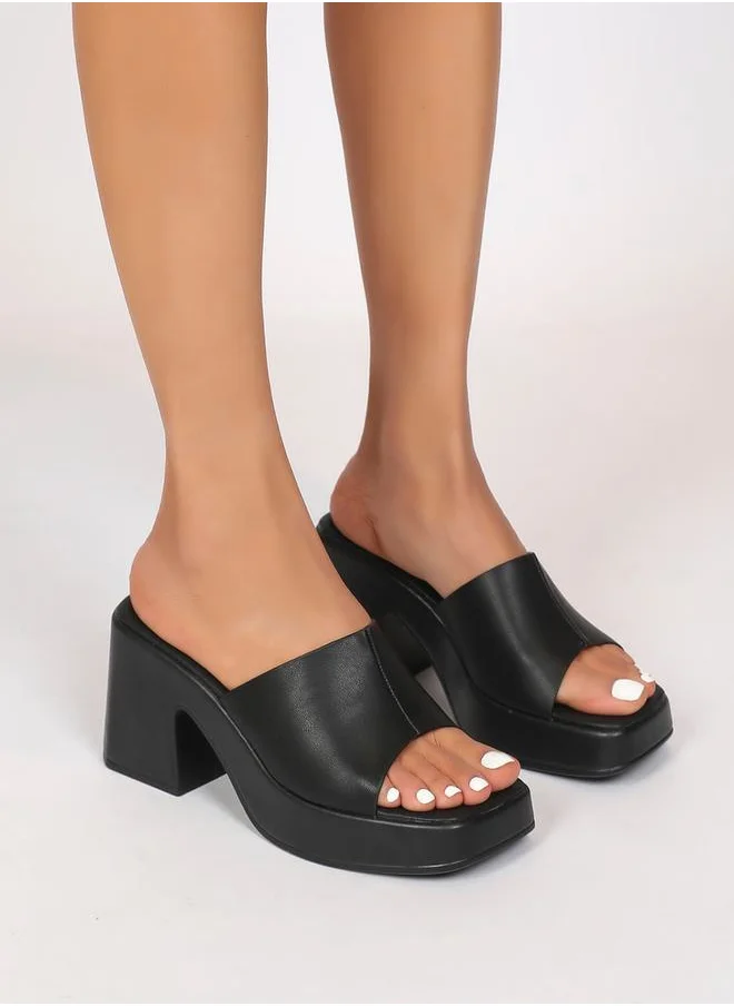 Sneak-a-Peek Solid Block Heel Sandals by Styli