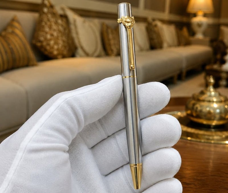 A ballpoint pen adorned with a panther (tiger) tip.