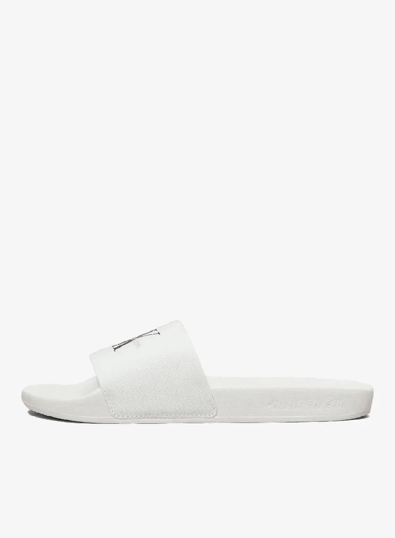 Calvin Klein Jeans Bright White/Black Canvas Sliders for Women | Best Price UAE