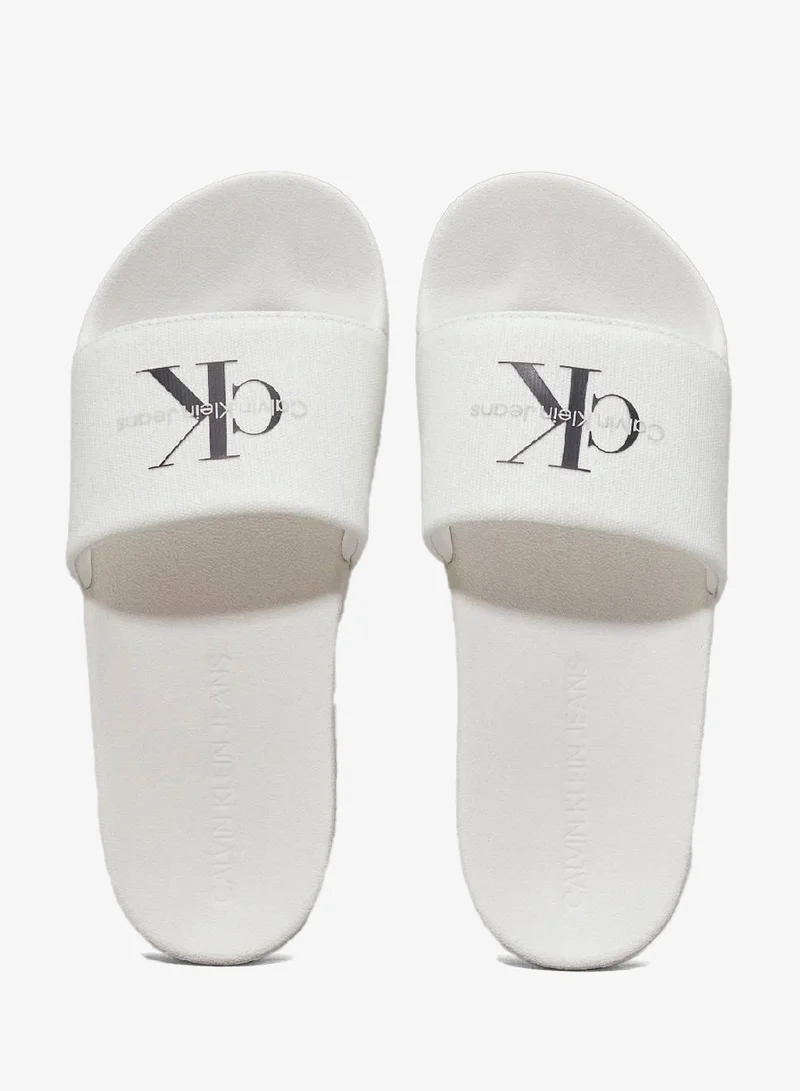 Calvin Klein Jeans Bright White/Black Canvas Sliders for Women | Best Price UAE