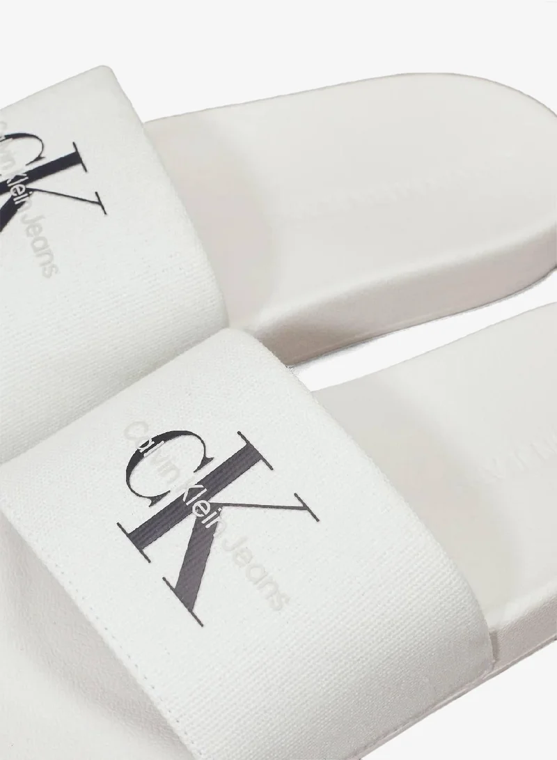 Calvin Klein Jeans Bright White/Black Canvas Sliders for Women | Best Price UAE