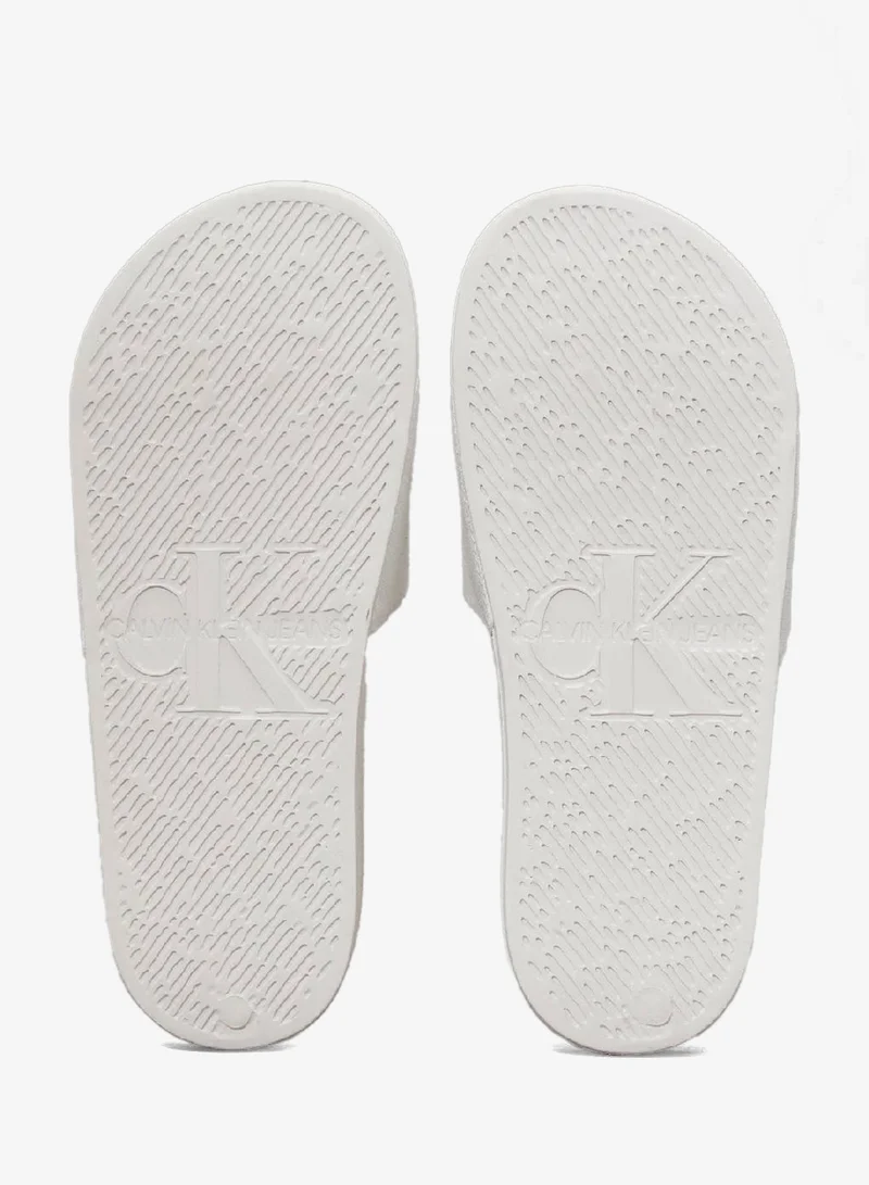Calvin Klein Jeans Bright White/Black Canvas Sliders for Women | Best Price UAE