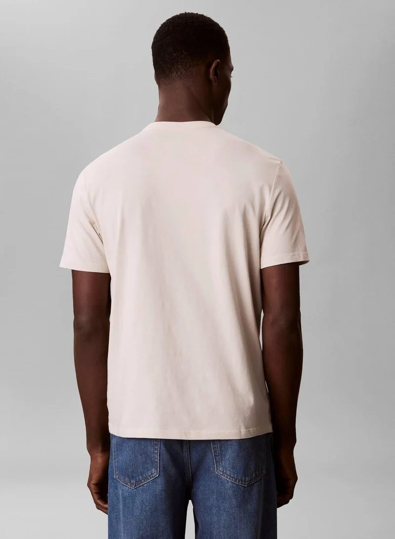 Calvin Klein Jeans Oatmeal 1968 Logo Graphic T-Shirt for Men | Best Price UAE