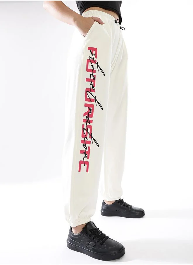 هوبرهولمي Women Track Pants in Off White featuring Jogger fit with a printed pattern, no sleeves, regular length, secured with elasicated + drawstring closure, crafted from terry – a trendsetting piece that blends fashion and comfort.