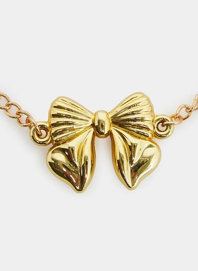 Styli Gold Tone Bow Necklace and Bracelet Set