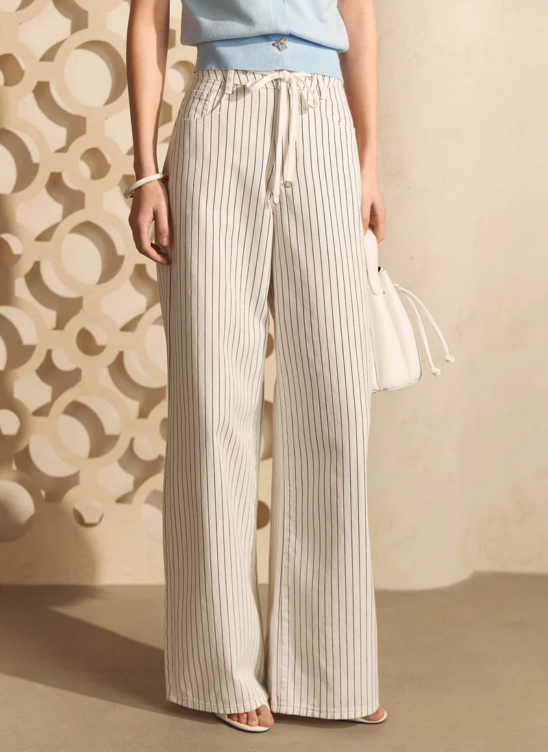 Relaxed striped jeans with waist ties